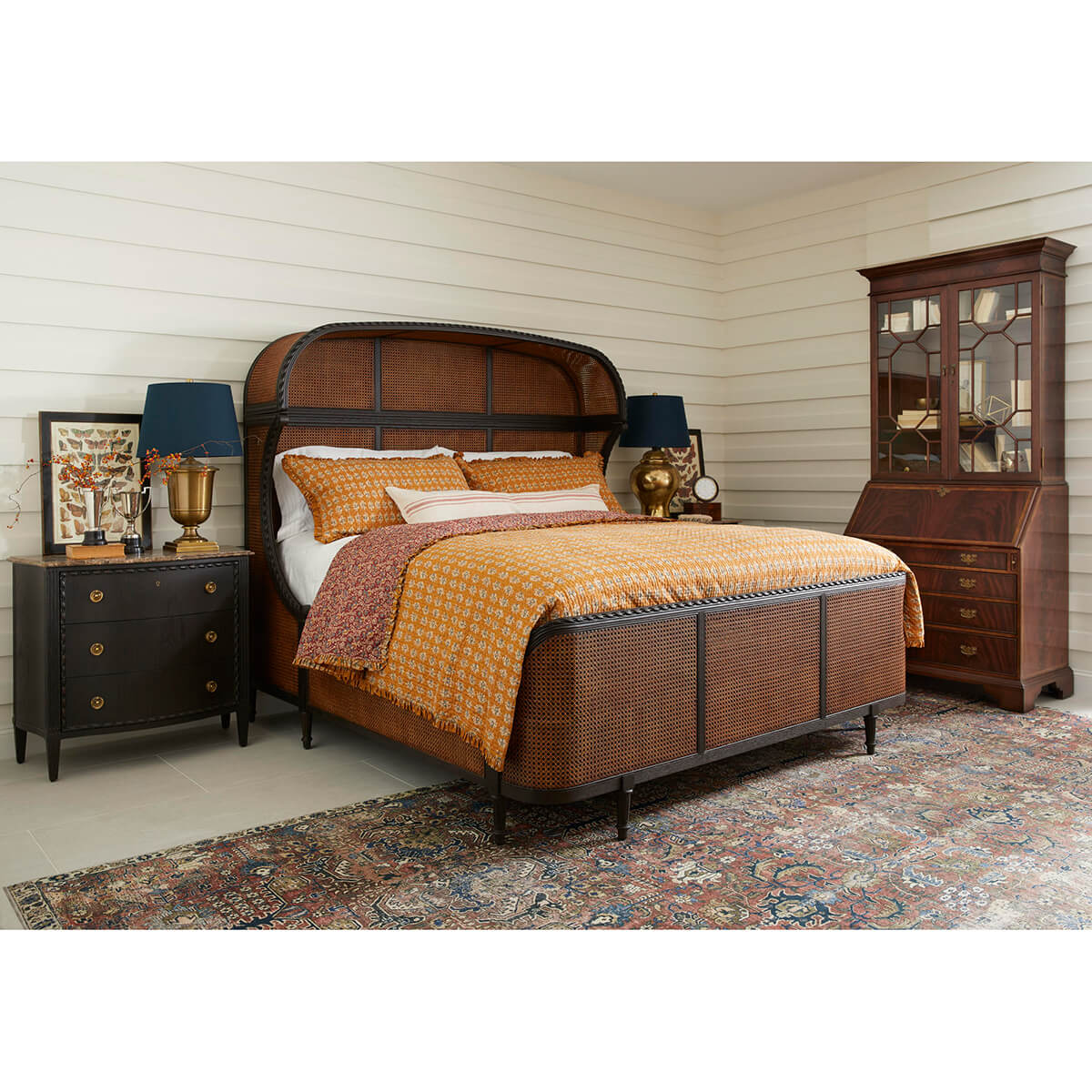 Bedroom with George III secretary bookcase and stylish decor.