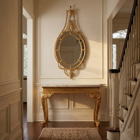 Elegant entrance featuring George III mirror and console table.