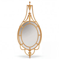 Ornate George III mirror with oval glass frame.