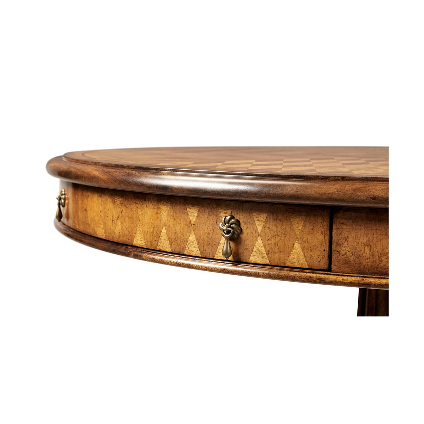 Detail of table edge and decorative drawer knobs.