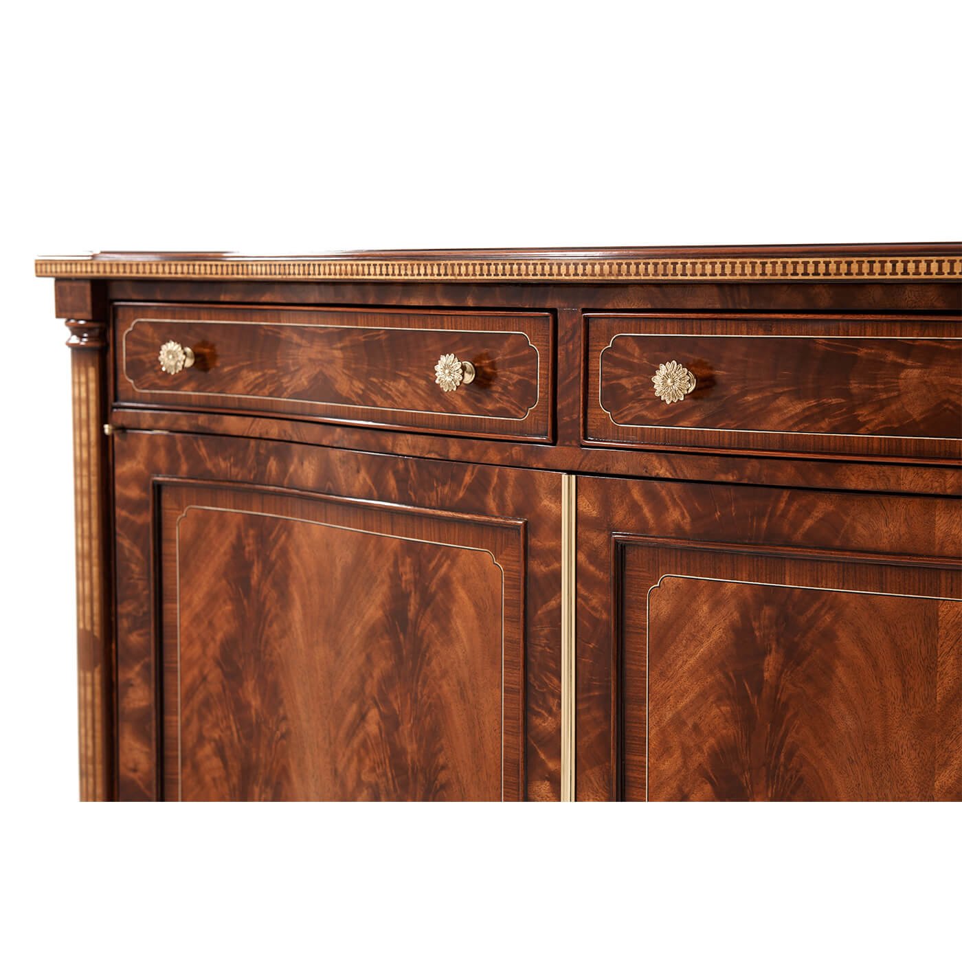 Credenza close-up of drawers and ornate knobs.
