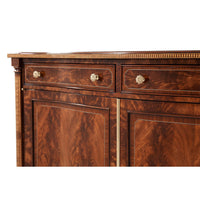 Credenza close-up of drawers and ornate knobs.