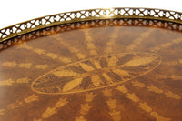 Close-up of table's detailed parquetry and brass gallery.