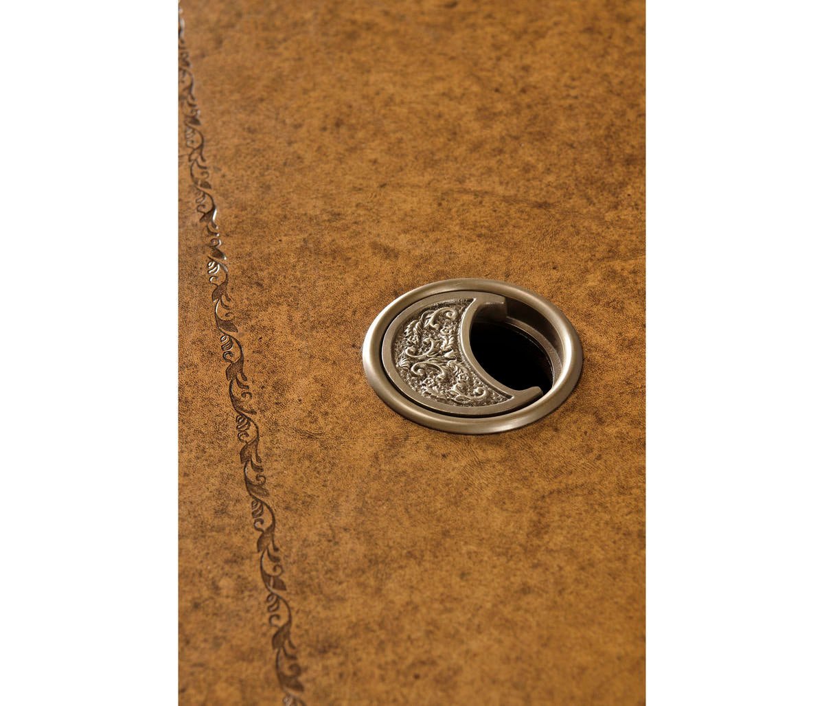 Close-up of leather desk top, metal detail.