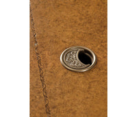Close-up of leather desk top, metal detail.