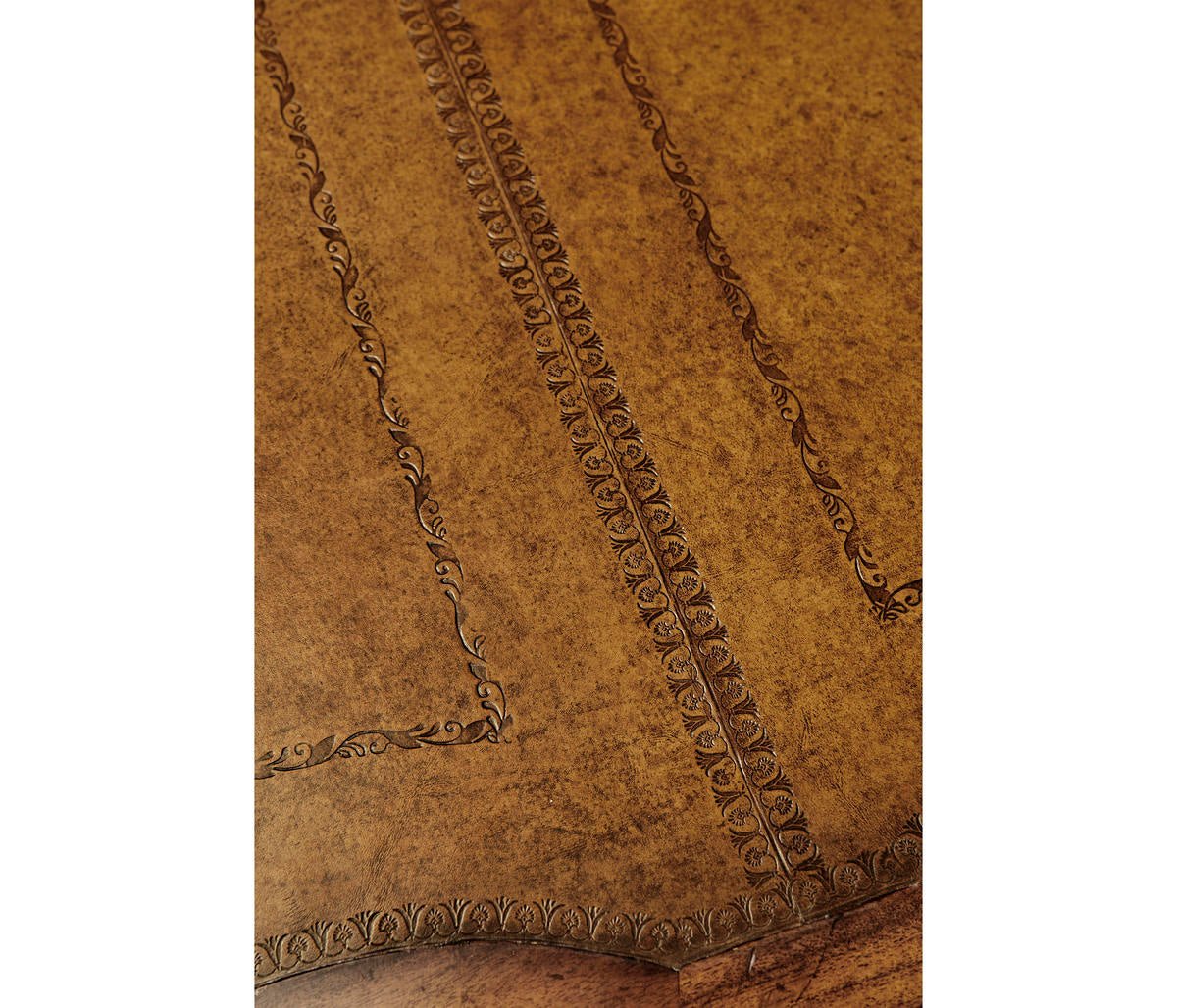 Detailed pattern on leather top of desk.