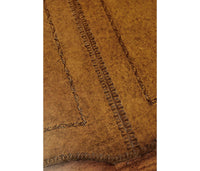 Detailed pattern on leather top of desk.