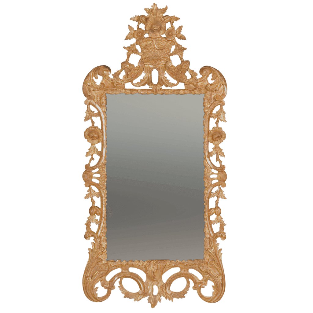 Ornate giltwood rococo mirror with floral designs.