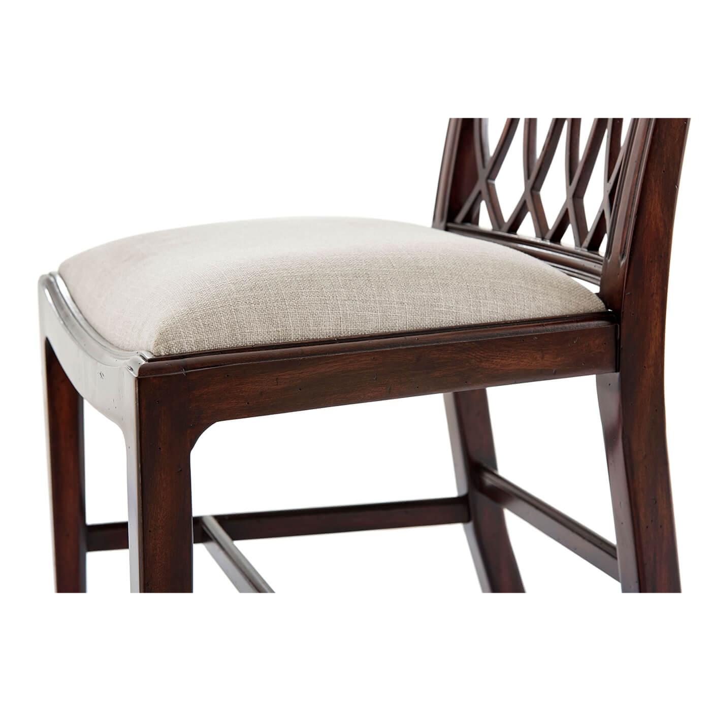 Close-up of cushioned seat on wooden dining chair.