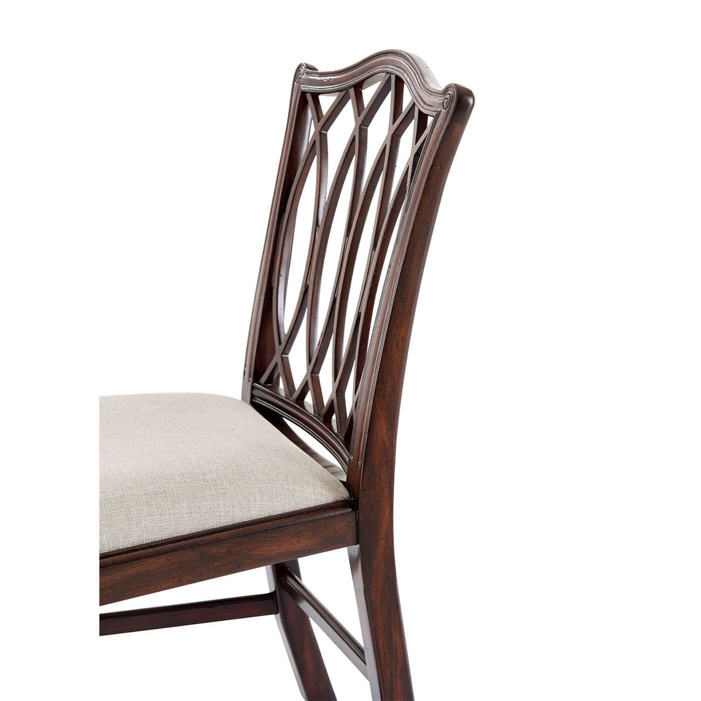 Detailed trellis back design on wooden dining chair.
