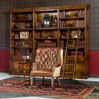 Leather barrel chair in elegant library setting.