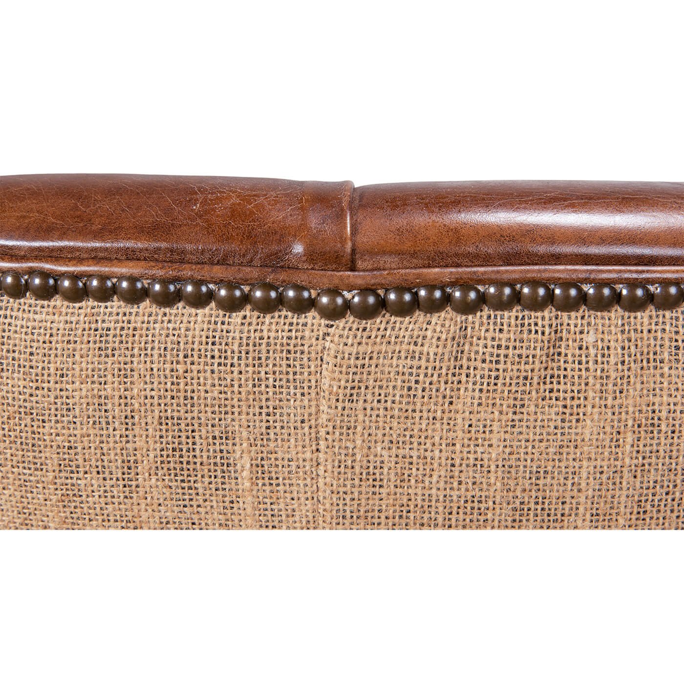 Chair top edge with leather and nailhead detail.