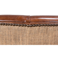 Chair top edge with leather and nailhead detail.