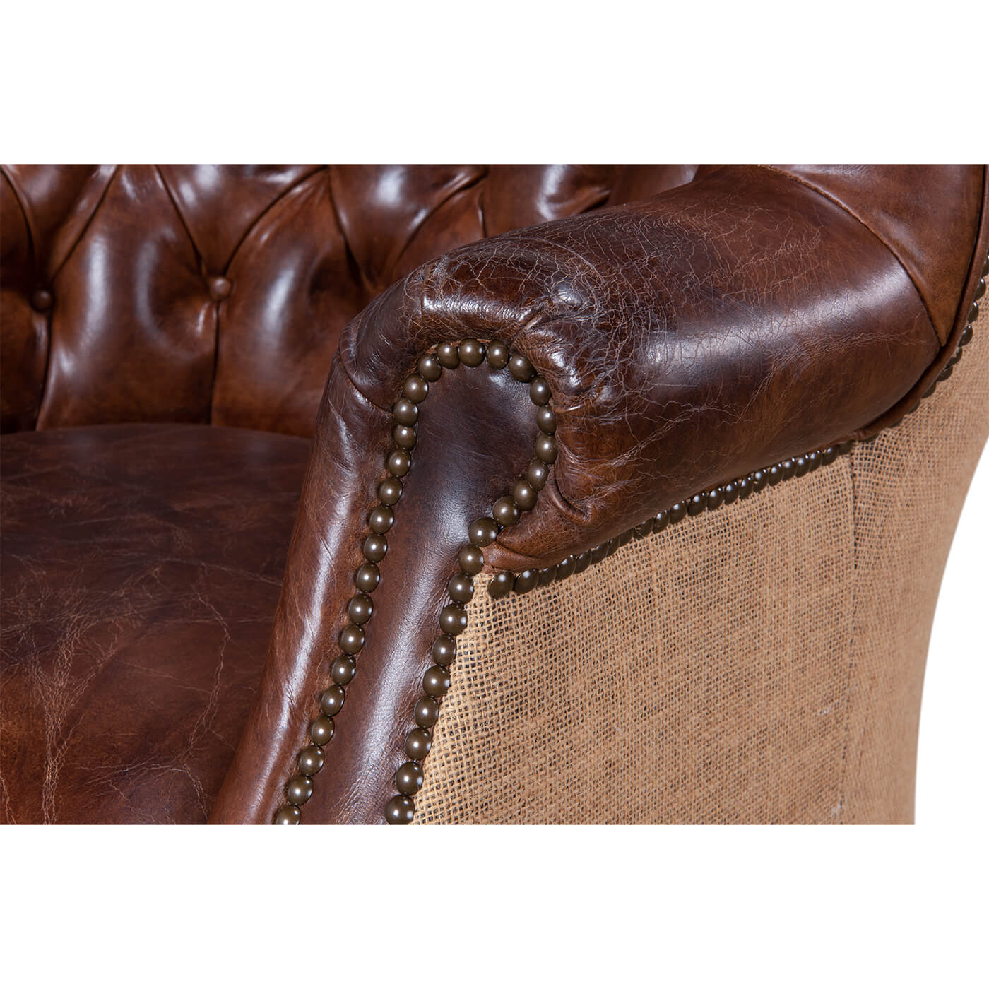 Close-up of chair arm, leather and jute detail.