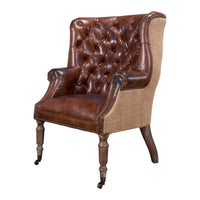 Leather and jute barrel chair, angled front view.