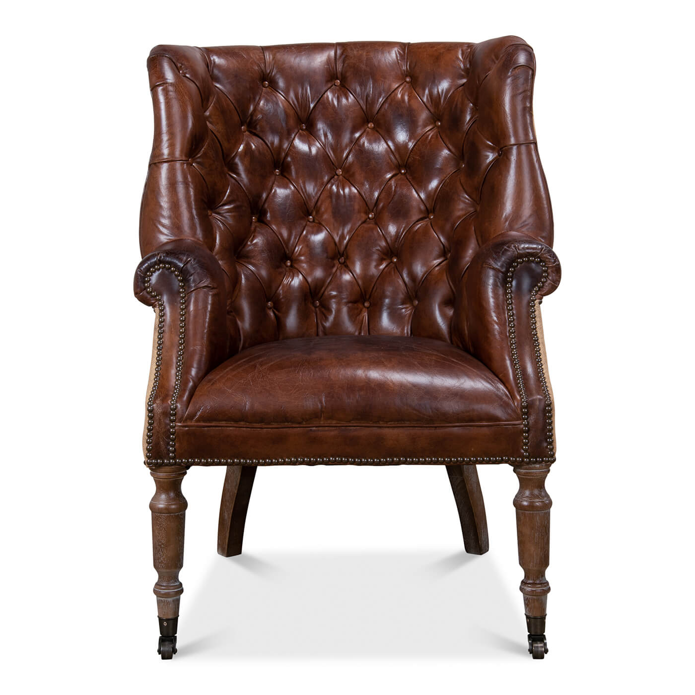 Leather tufted barrel chair, front view.