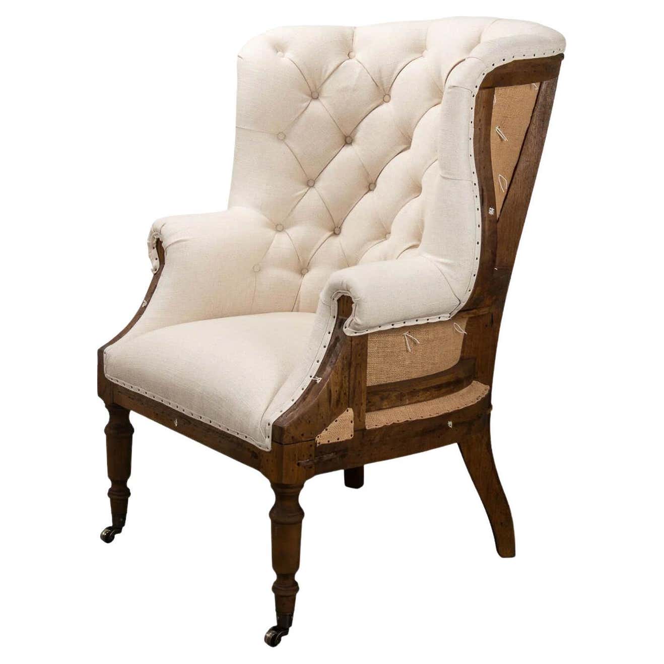 Georgian wingchair front view with tufted upholstery.