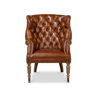 Front view of tufted leather wingchair.