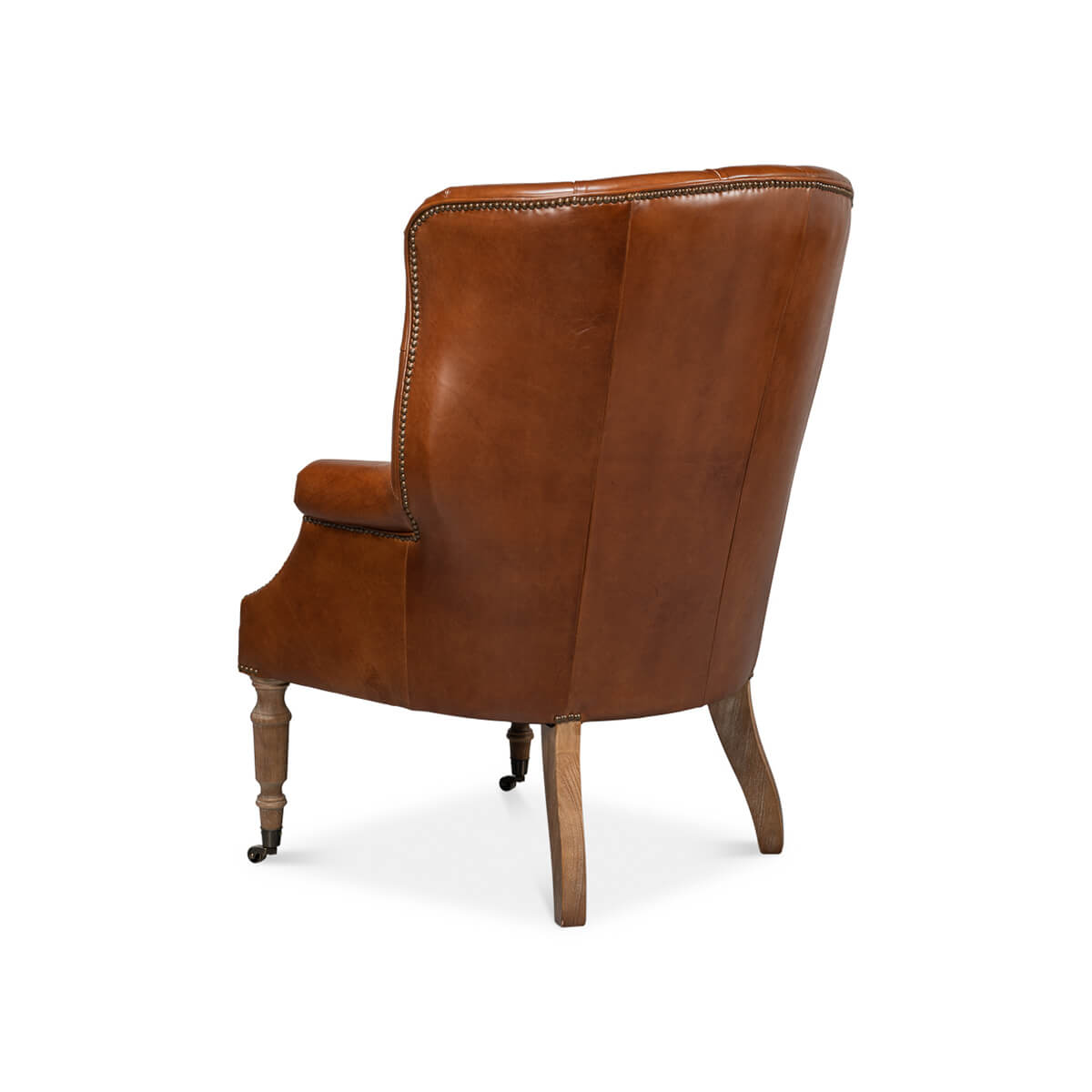 Back view of brown leather wingchair.