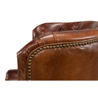 Close-up of leather wingchair back detailing.