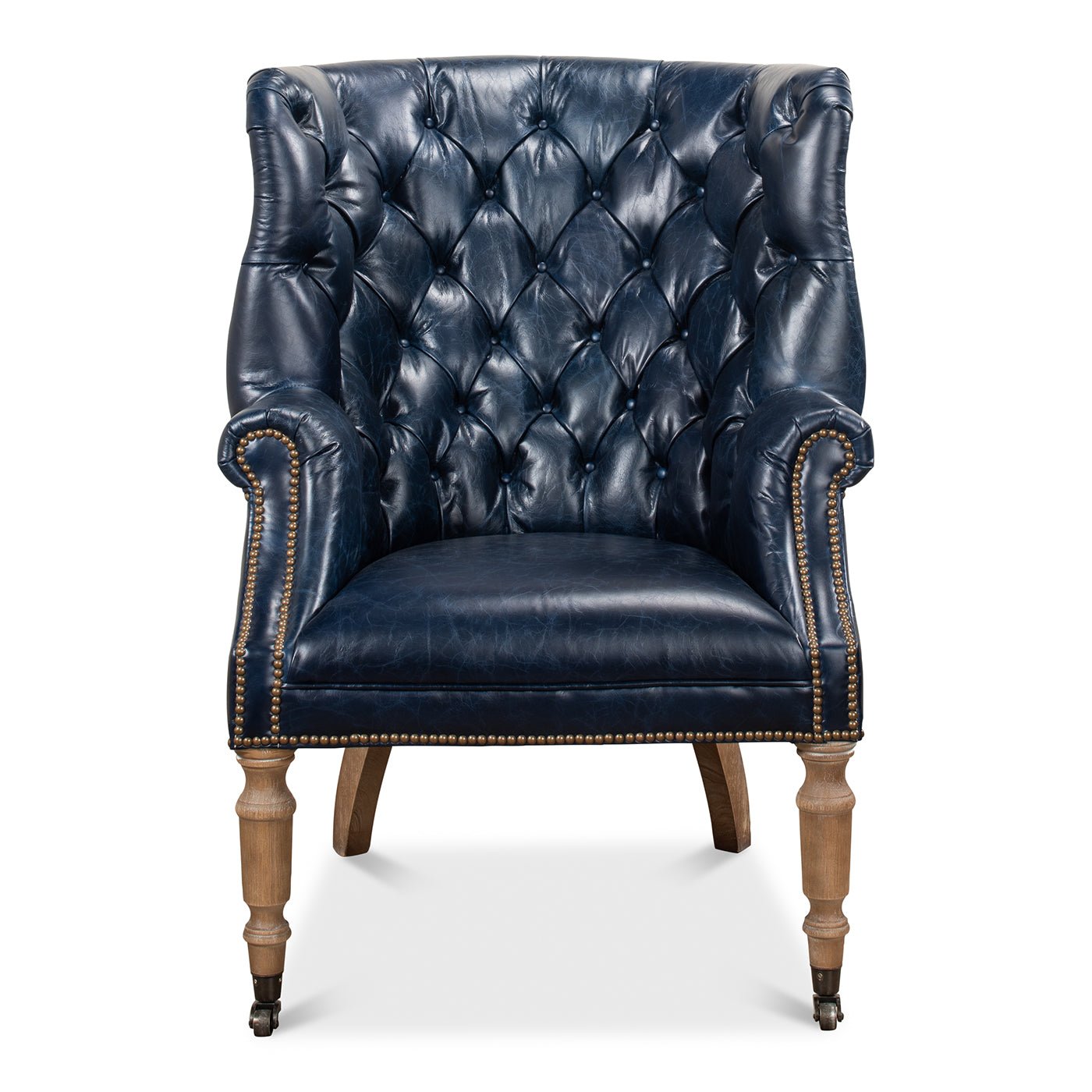Front view of blue tufted wingchair with wooden legs.