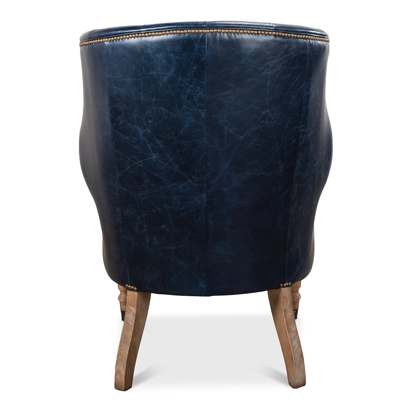 Back view of blue wingchair with curved design.