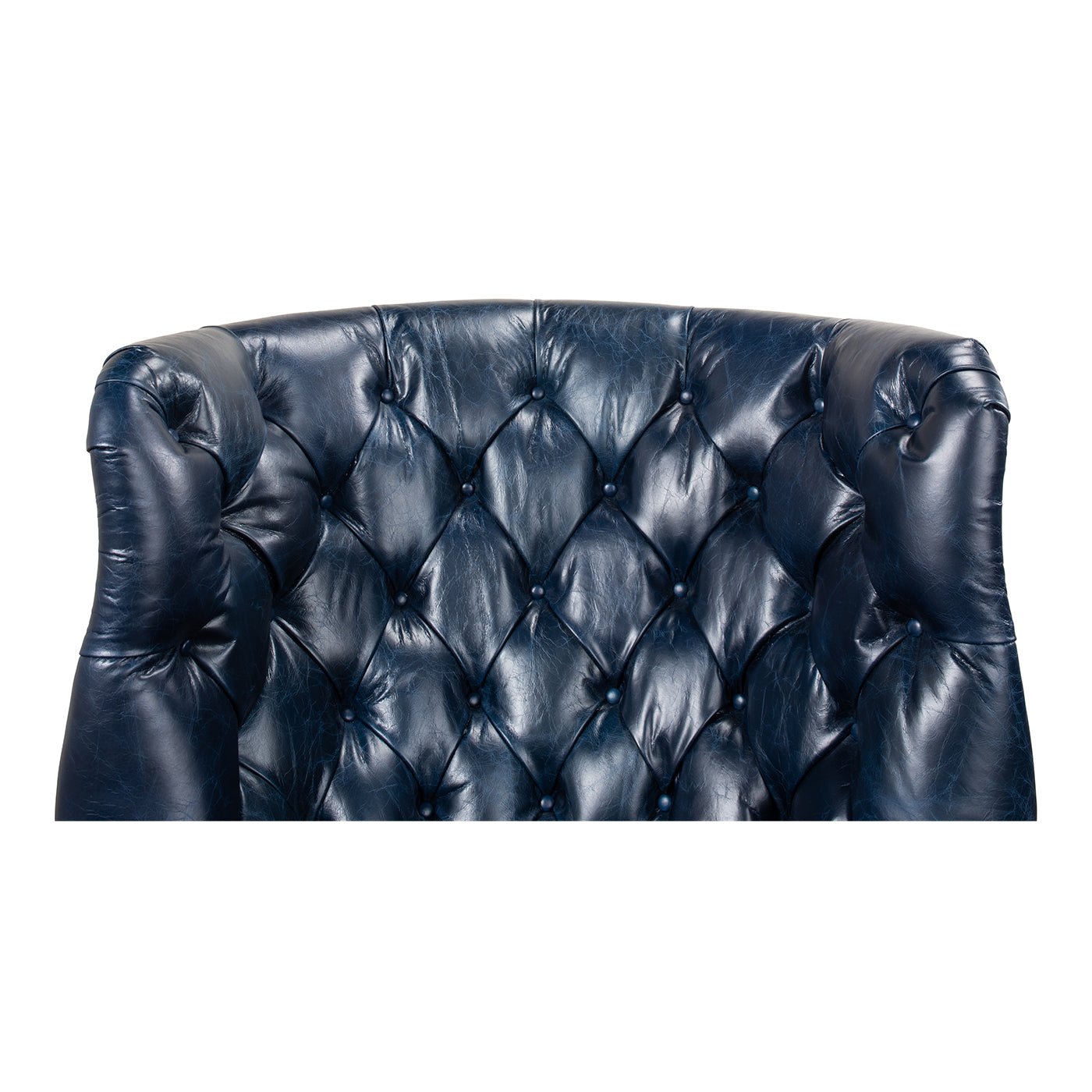 Close-up of tufted design on blue wingchair.