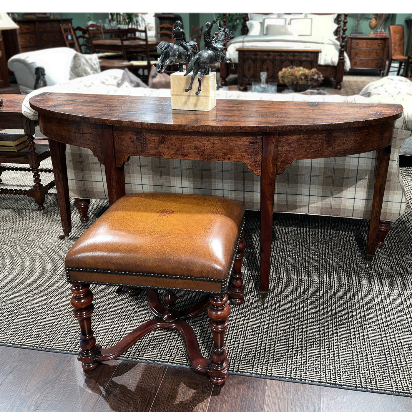 Georgian console table in furnished room, stool in foreground.