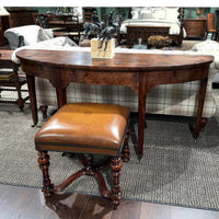 Georgian console table in furnished room, stool in foreground.
