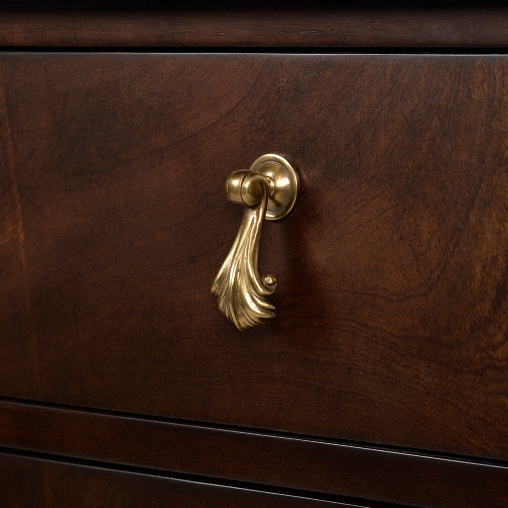 Detailed view of drawer handle on Georgian mahogany chest.