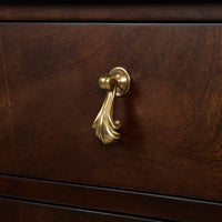 Detailed view of drawer handle on Georgian mahogany chest.