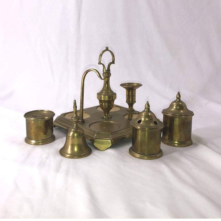 Brass inkwell set, components removed, on white background.