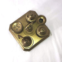 Top view of Georgian brass inkwell with candle holder.