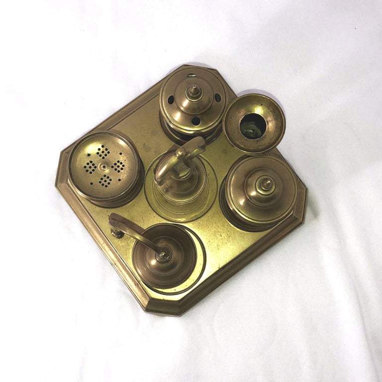 Top view of Georgian brass inkwell with candle holder.