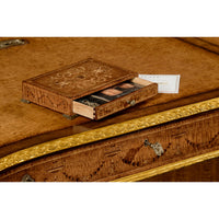 Close view of Georgian desk's drawer with decorative carvings.