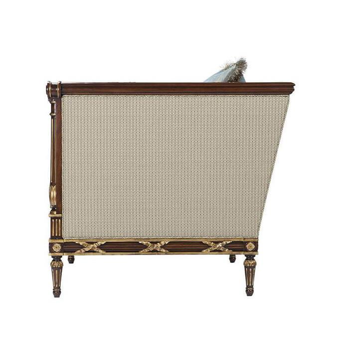 Side view of Georgian mahogany armchair detailing.