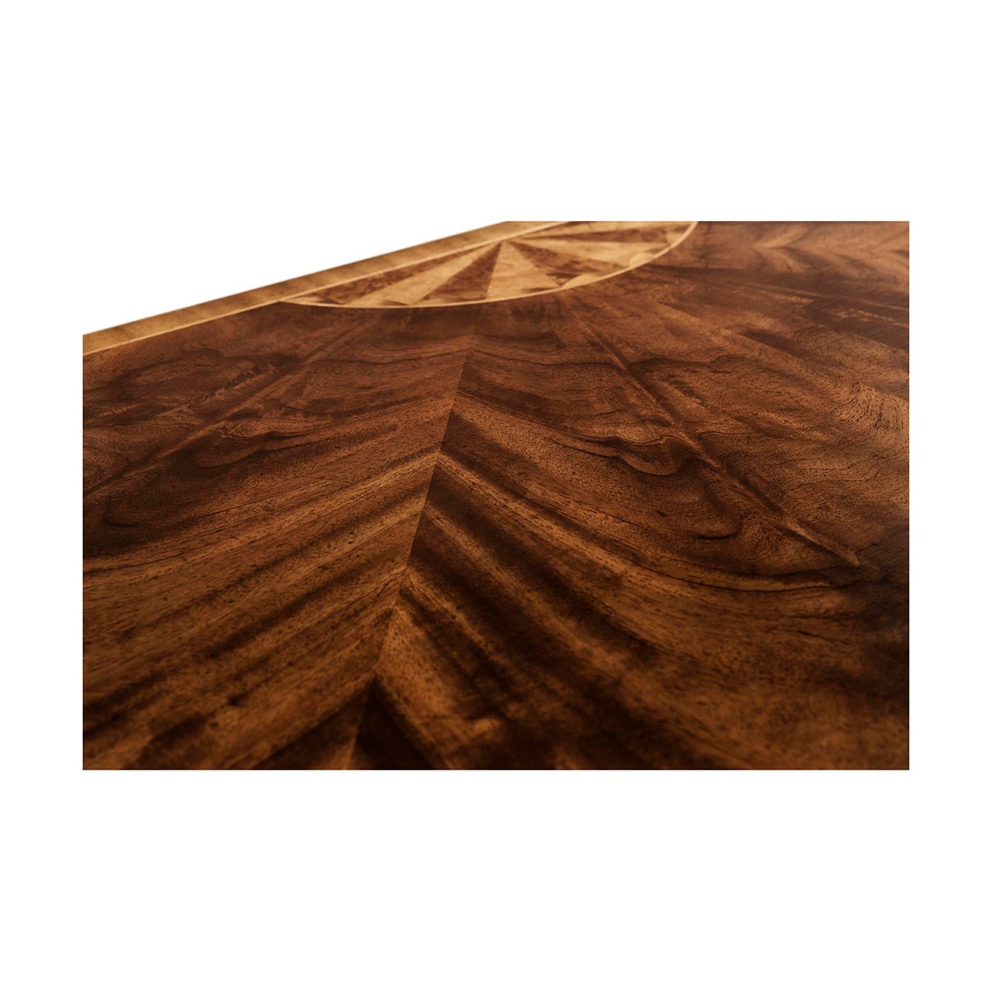 Top surface detail of mahogany demilune chest of drawers.