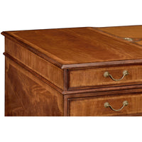 Close-up of desk corner showing wood texture and craftsmanship.