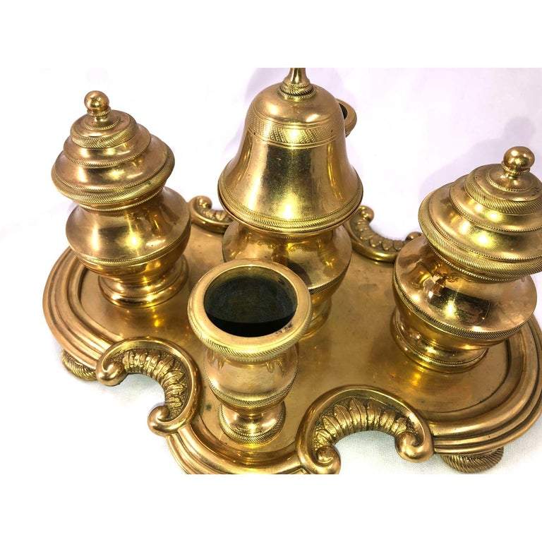 Top view of gilt bronze desk set with intricate design.