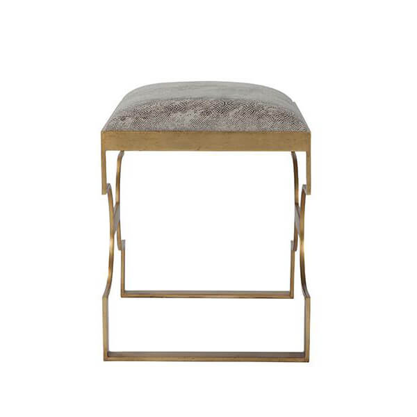 Side profile of gilt steel upholstered stool frame.