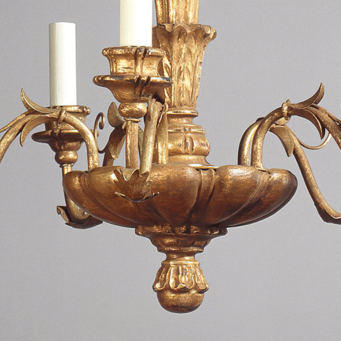 Base detail of Rococo chandelier, intricate woodwork.