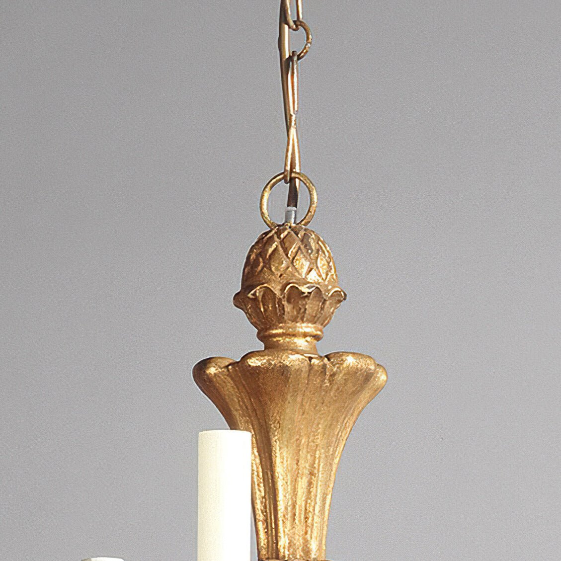 Top section of Rococo chandelier with ornamental design.