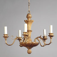 Elegant five-light chandelier in ornate Rococo style.