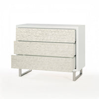 Open drawers on glam minimalist chest of drawers.