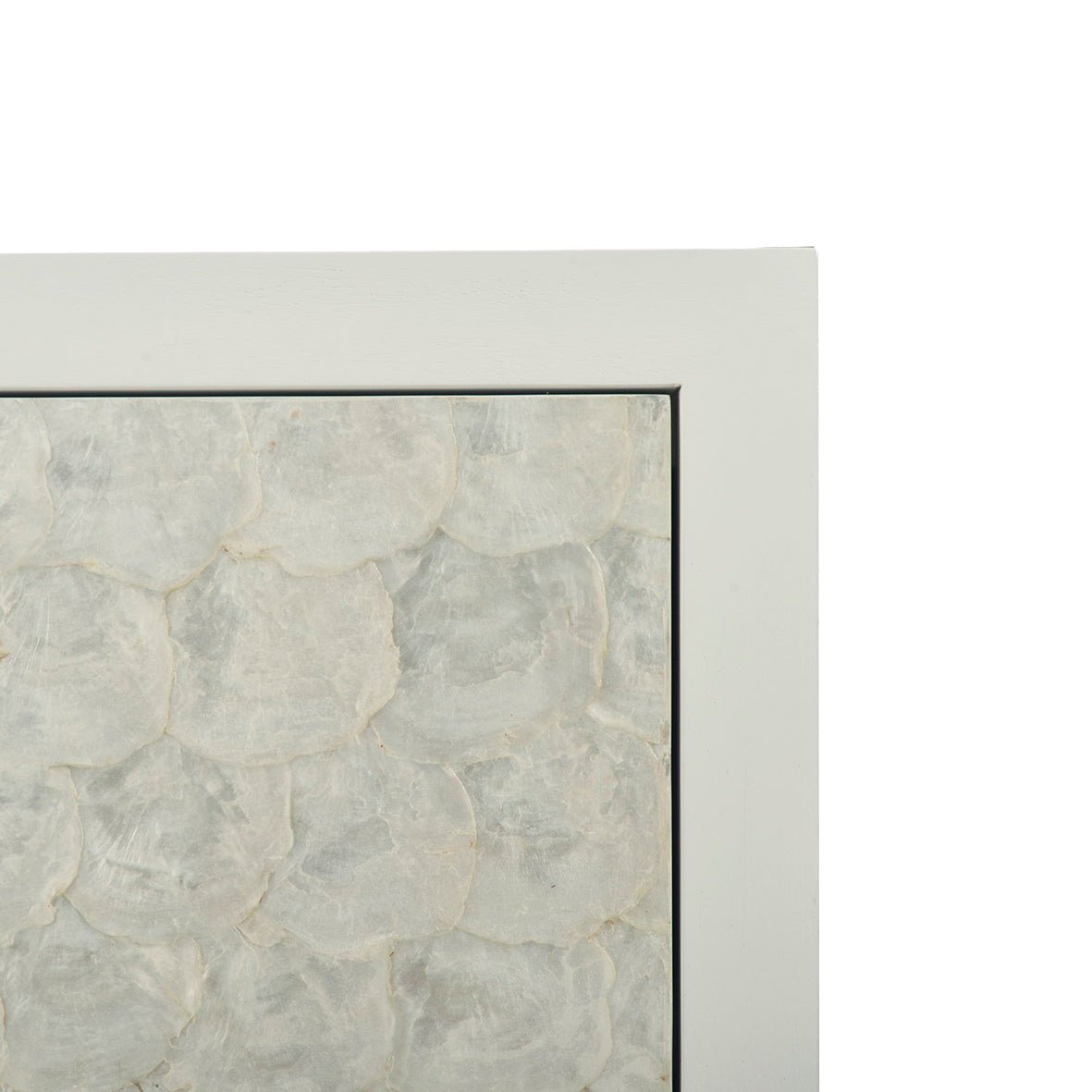 Close-up texture on glam minimalist chest drawer front.