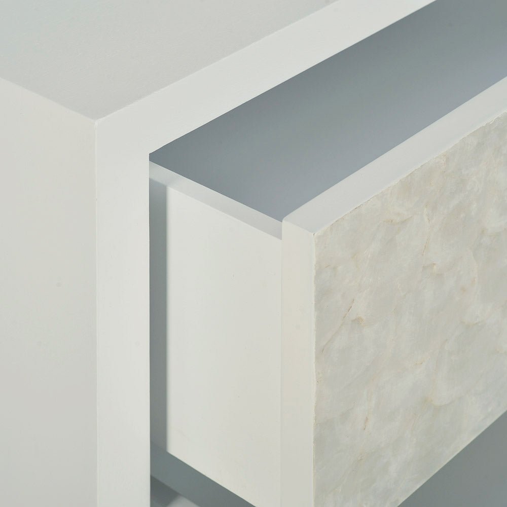 Close-up of open drawer detail, glam minimalist chest.