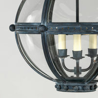 Lantern frame detail with candle-style bulbs, spherical design.