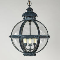 Globe lantern hangs with clear glass panels, detailed look.