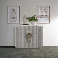 Gray bar cabinet styled with decor in living room.