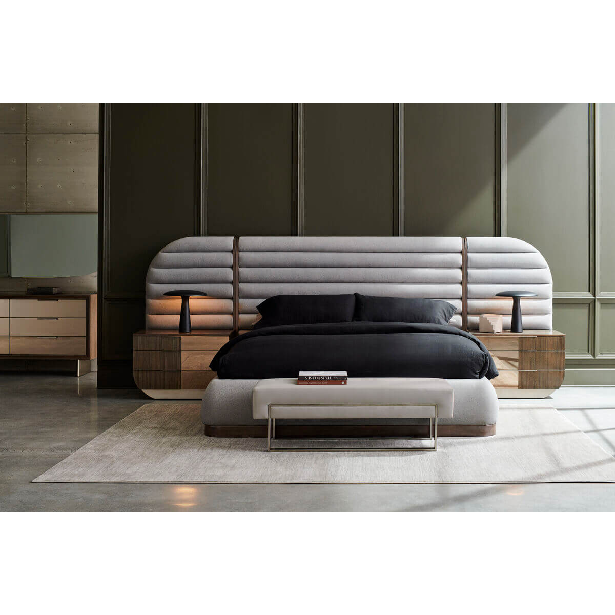 Full bedroom with gray channeled king bed and furniture.